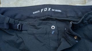 Close up of waist fastening on a pair of MTB trail pants