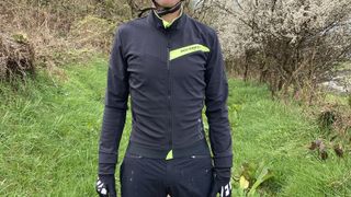 Mountain biker wearing Rockrider Slim-Fit Softshell Mountain Biking Jacket