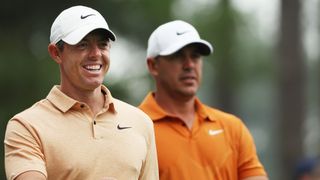 Rory McIlroy and Brooks Koepka walk during a Masters practice round