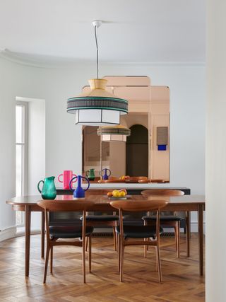Mid-century modern dining room with copper mirror
