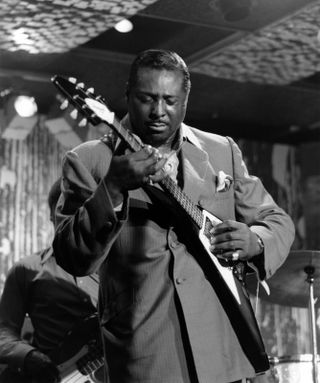 Albert King (1923-1992) performs live on stage playing his Gibson Flying V guitar at Ronnie Scott's Jazz club in Soho, London circa 1970.