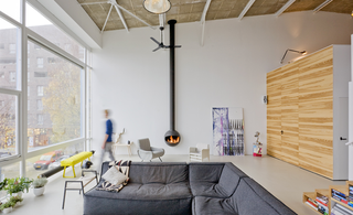 A fireplace helps to heat the main living area