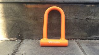 A bright orange Ottolock Sidekick D-lock