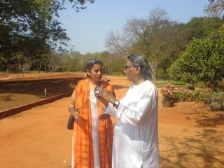 Anupama Kundoo and balkrishna doshi standing in the countryside