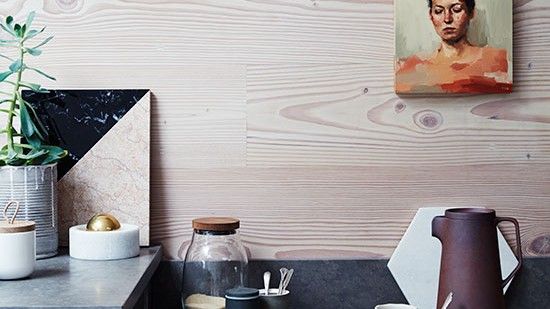 kitchen area with photo frame on plywood wall