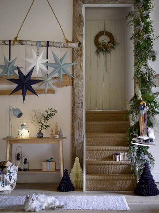 Christmas entryway with paper stars and honeycombs by Garden Trading