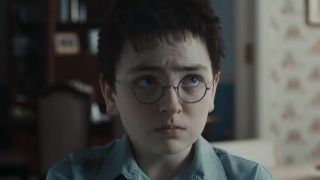 Dominic McLaughlin looking sad after getting his hair cut in the Harry Potter Season 1 triler.