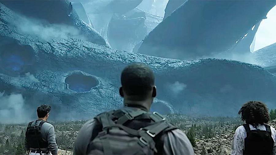three figures stare at a crashed spaceship in the distance