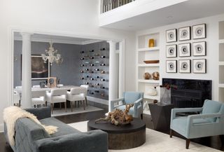 Gray and white living room with open plan dining area