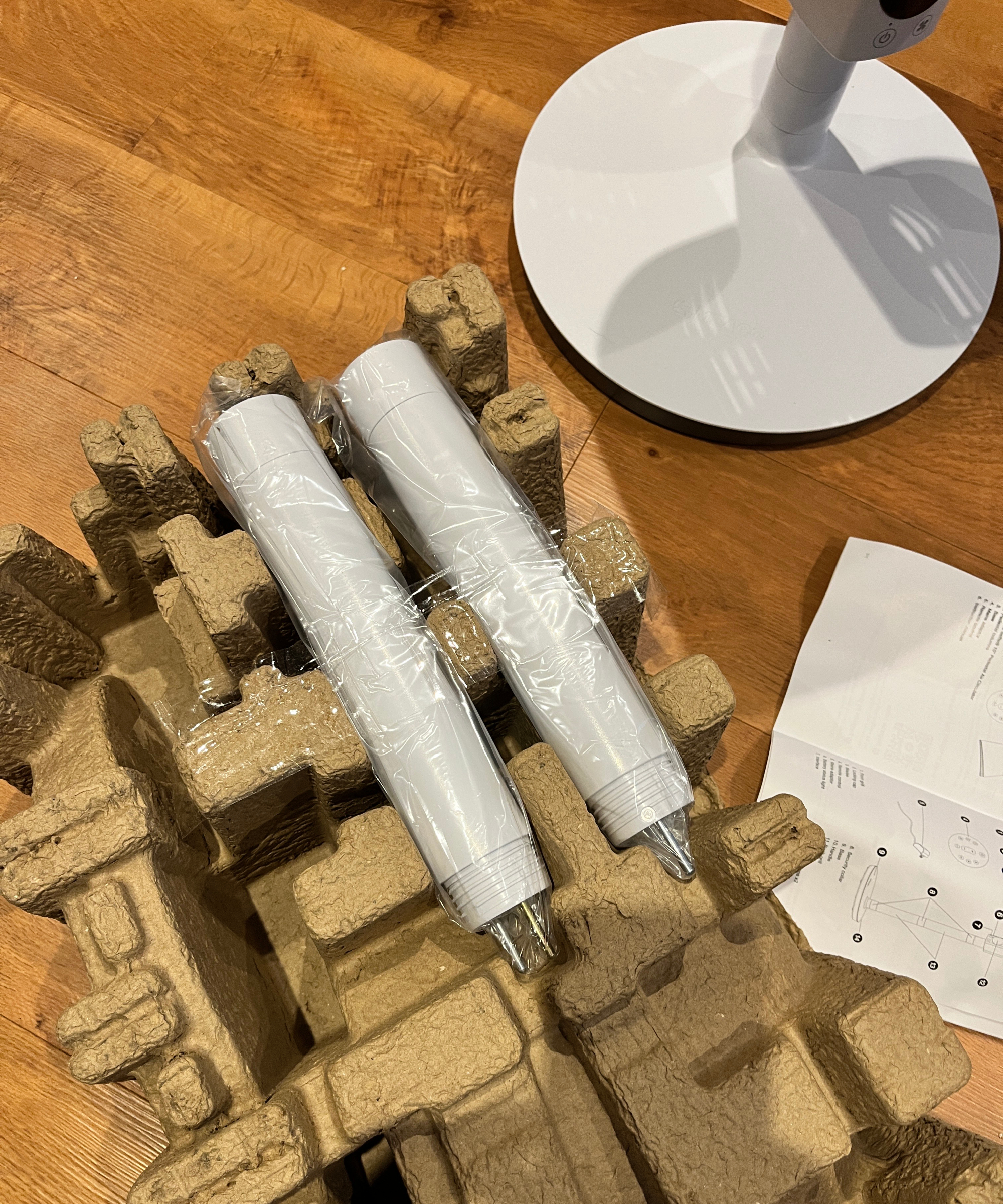 white columns placed in brown packaging with white fan base to one side