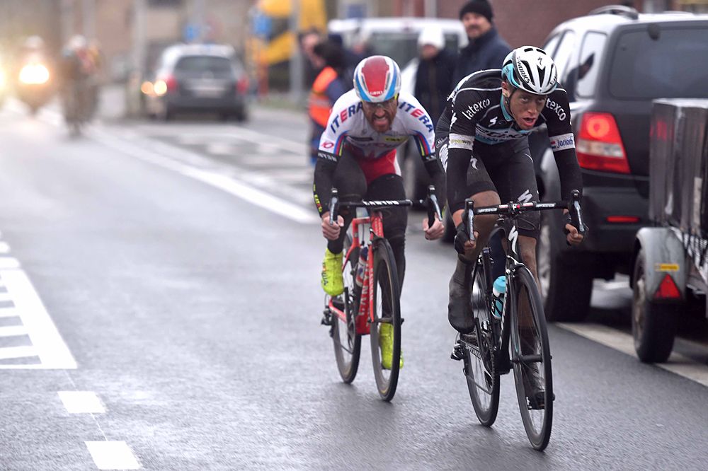The breakaway riders attack one another as the race nears the finish line