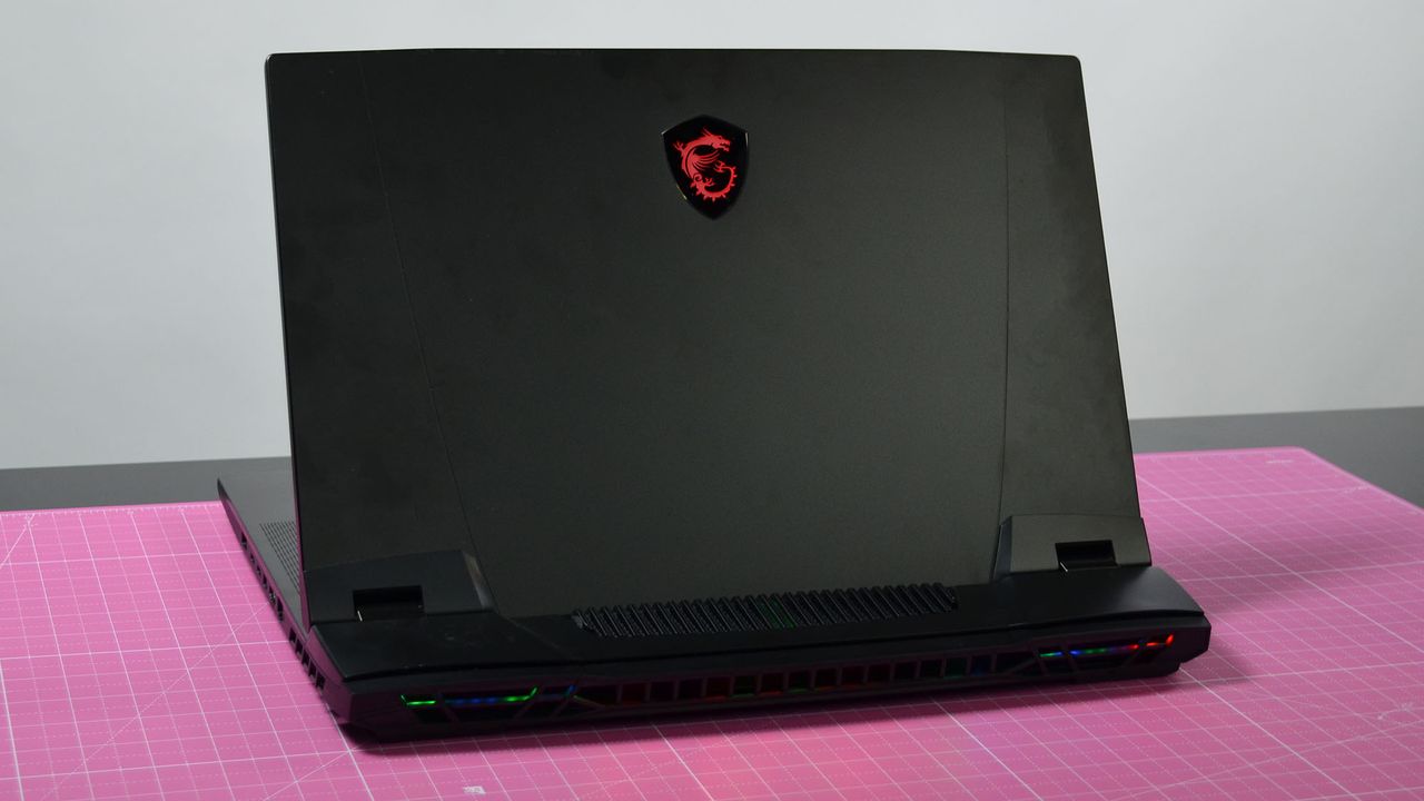 An MSI GT77 Titan on a pink desktop mat