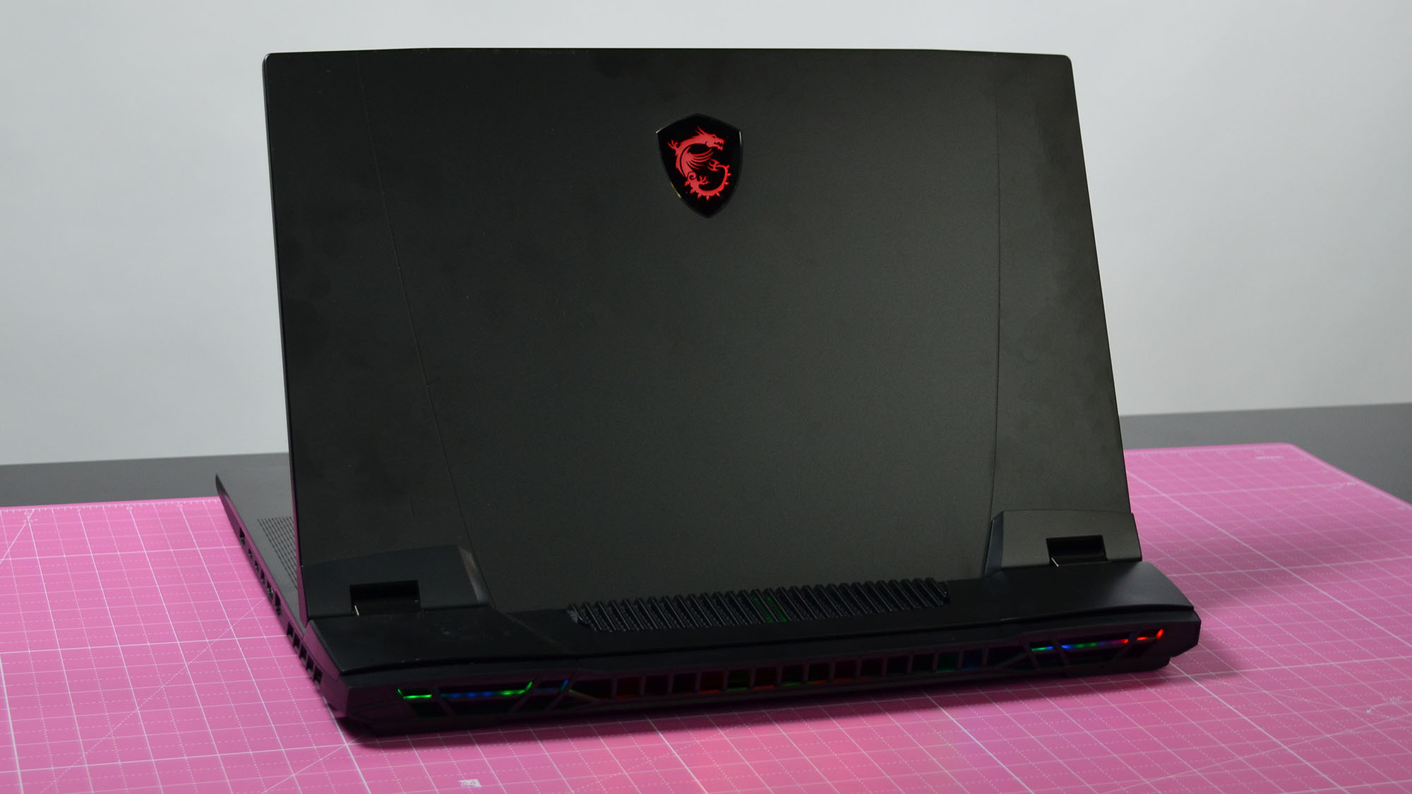 An MSI GT77 Titan on a pink desktop mat