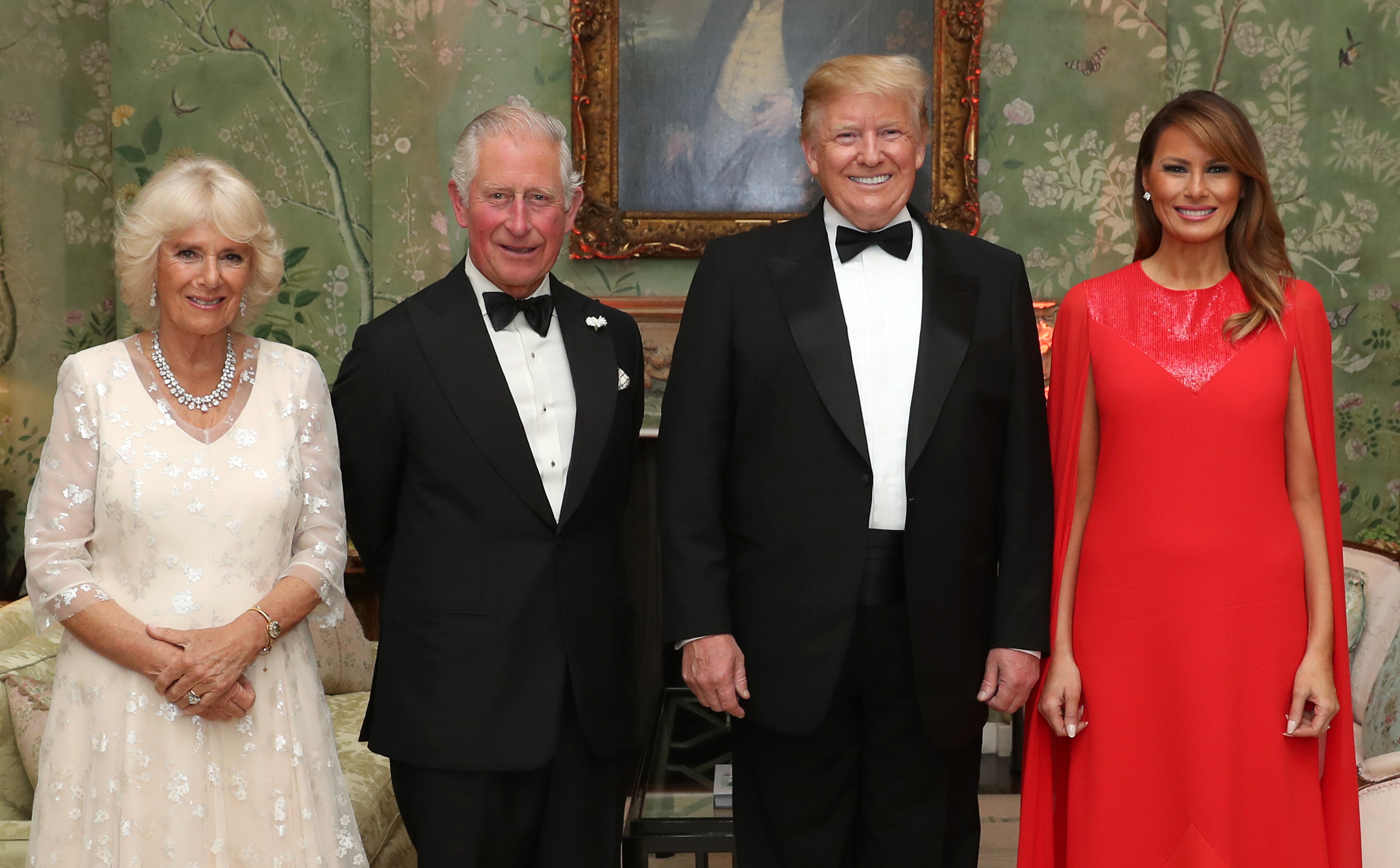 Queen Camilla, King Charles, Donald Trump and Melania Trump posing in formalwear in 2019