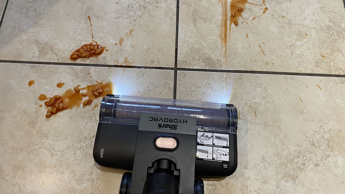 Shark HydroVac Cordless floor cleaner cleaning baked beans on a hard floor