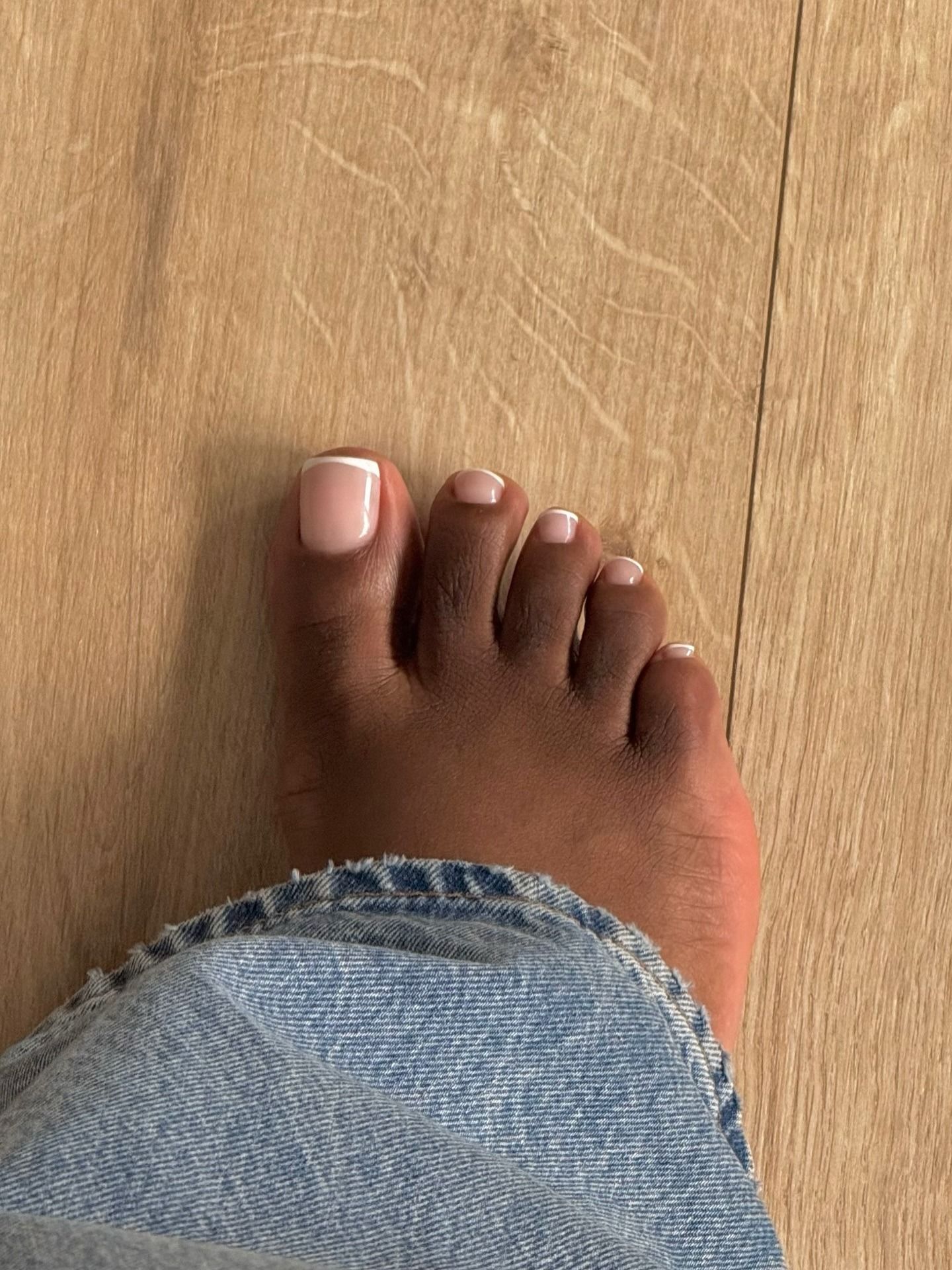 A picture of a classic French tip pedicure