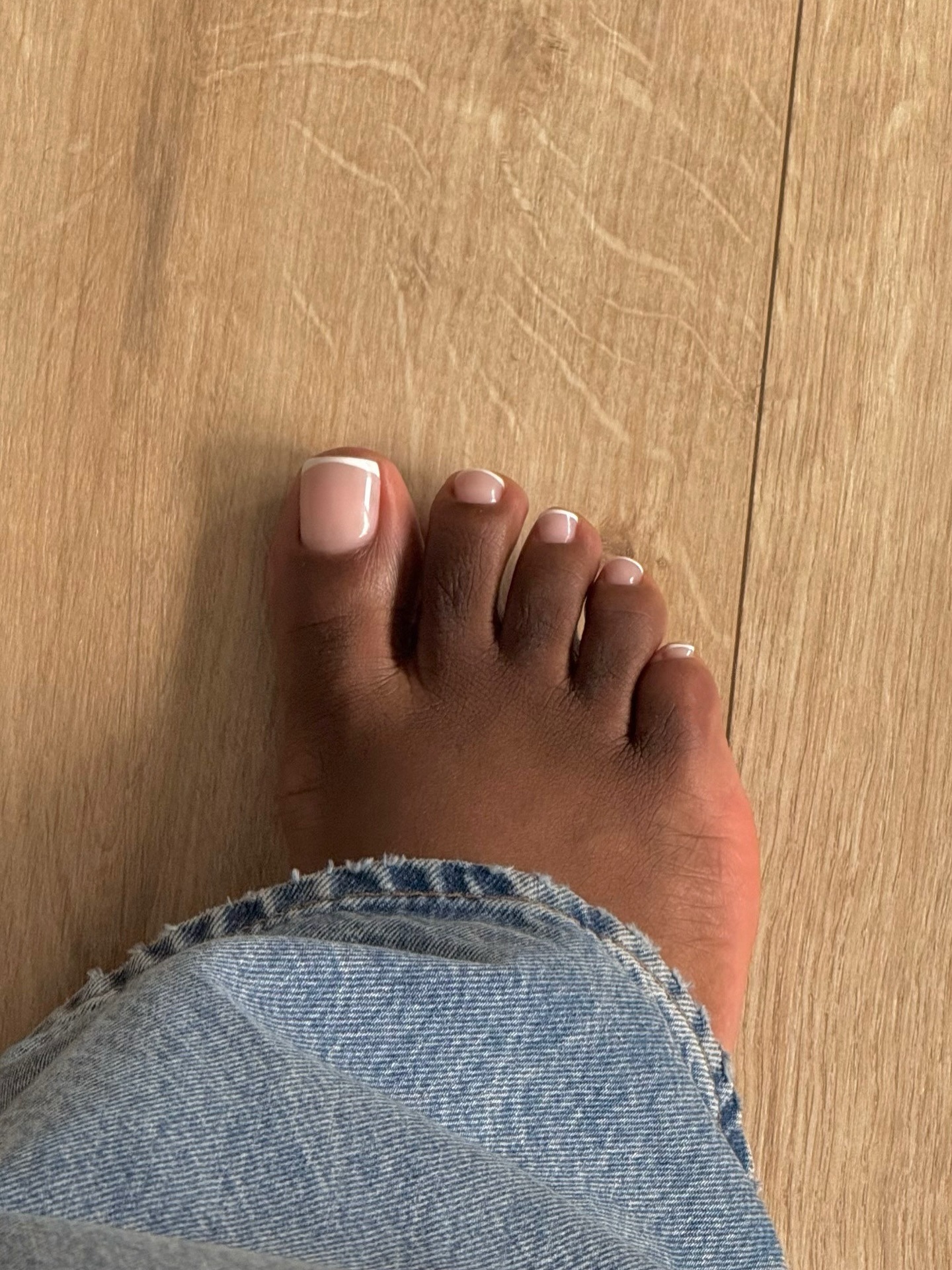A picture of a classic French tip pedicure