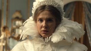 Enola (Millie Bobby Brown) tries on wedding dresses in Enola Holmes 3.