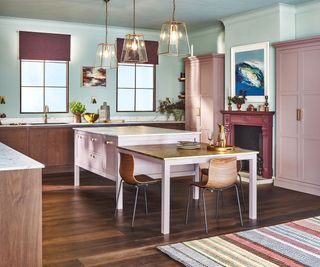 Two-tone kitchen cabinets with pink tall cabinets and wooden lower cabinets