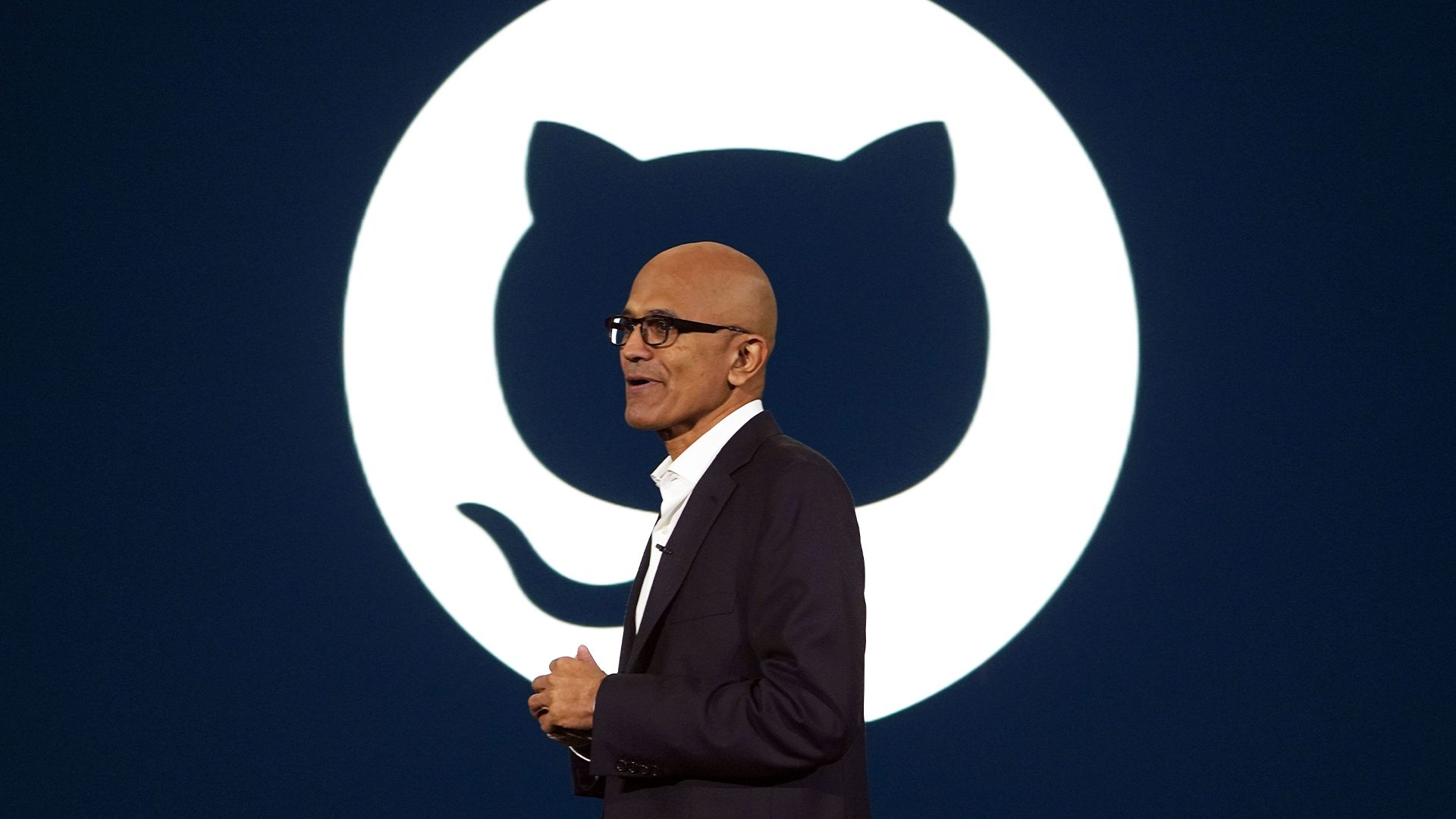 Microsoft CEO Satya Nadella pictured in front of the GitHub logo while speaking at a company event on AI technologies in Jakarta, Indonesia.