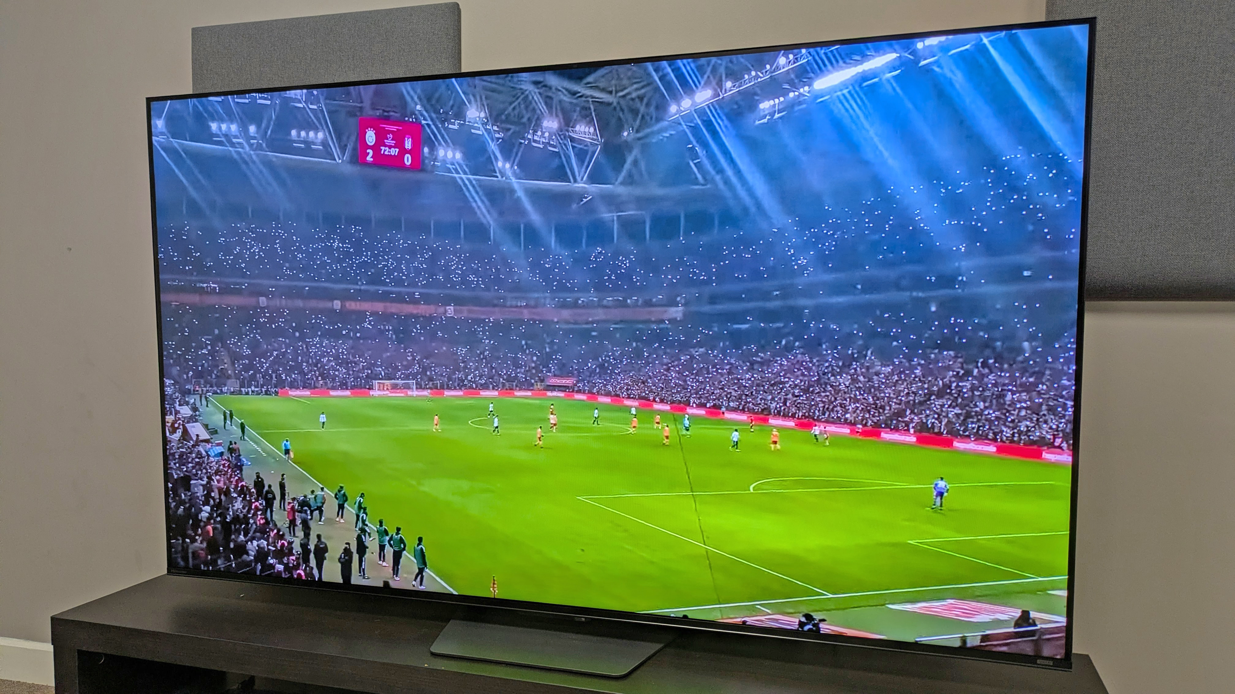Hisense U7S with footage of a football stadium on screen, taken from a right angle 