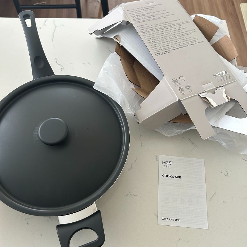 M&amp;amp;S All In One 28cm Saucepan on countertop with instruction manual and packaging