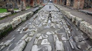 Deep ruts formed on Pompeii's paved streets as carts eroded the stones: "A" shows an area of street with deep ruts; "B" shows an area with repairs; section "C" shows another deeply rutted section.