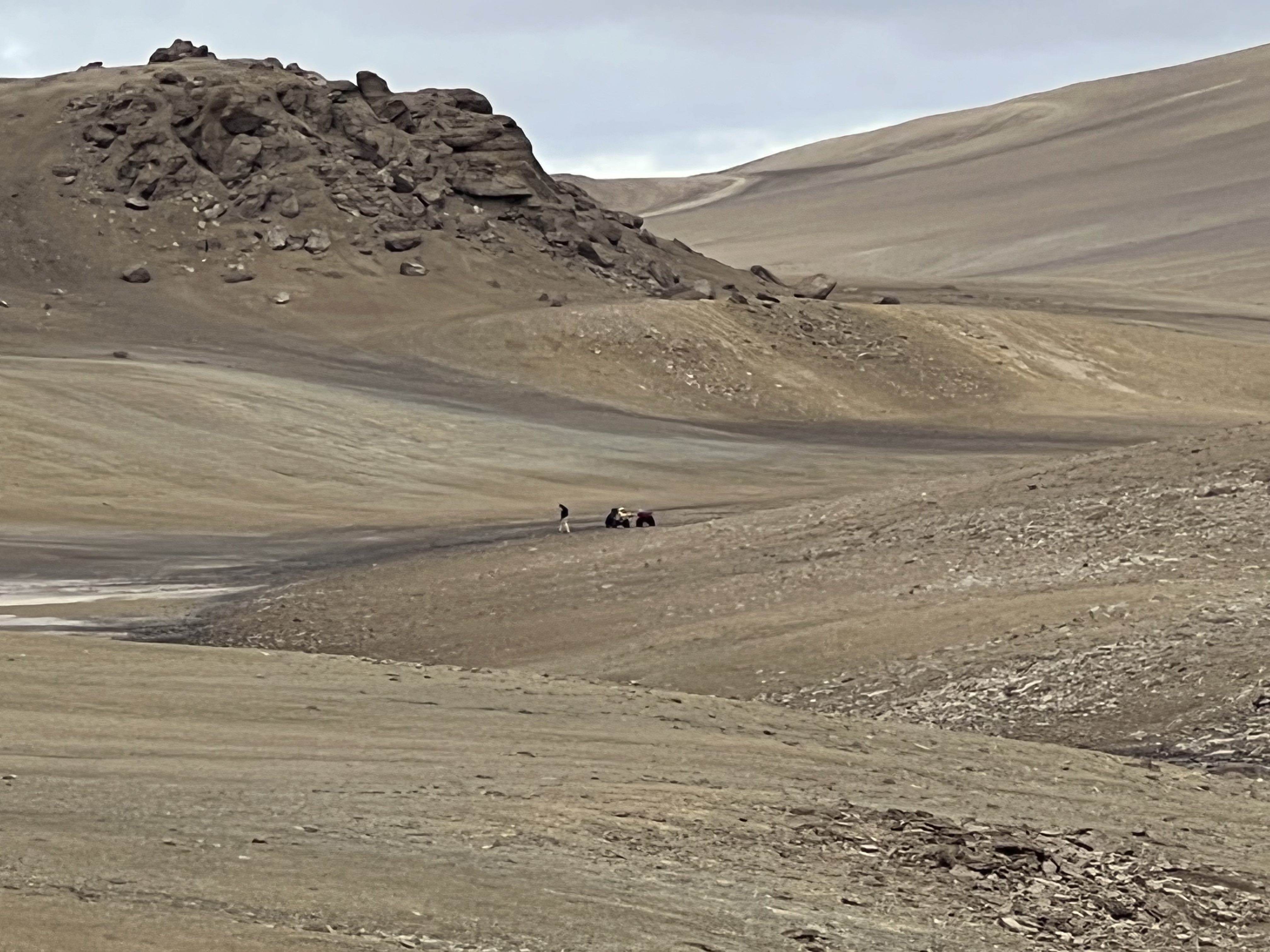 Typical geography of Devon Island, with Pascal Lee taking a soil sample