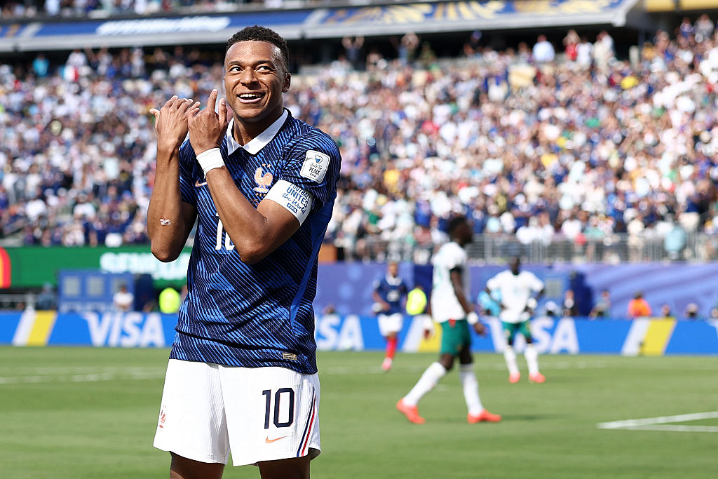 Kylian Mbappe celebrates by pretending to play the flute after scoring his team's first goal during the 2026 World Cup Group I football match between against Senegal at the New York/New Jersey Stadium