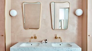 Tadelakt brings texture to a bathroom wall in pale pink