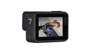 GoPro Hero 7 Black action camera with a back screen that shows a woman recording herself skateboarding