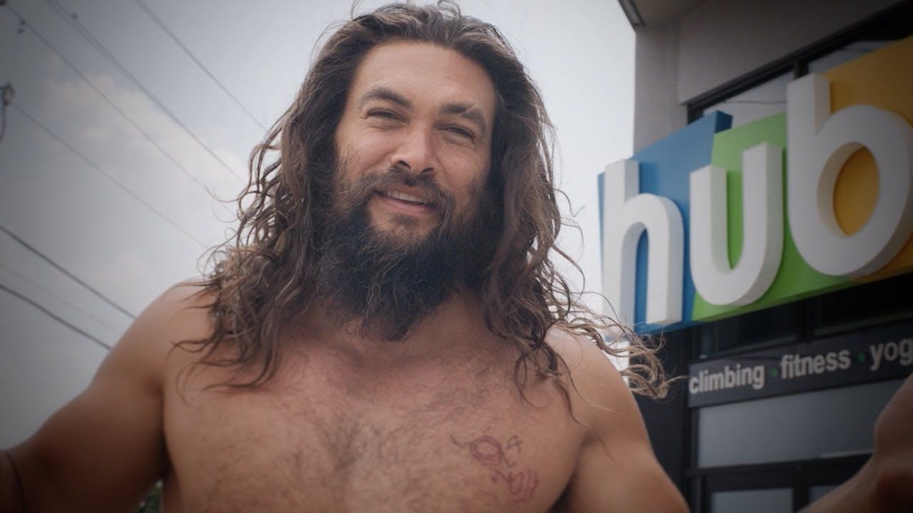 Jason Momoa in front of a climbing gym