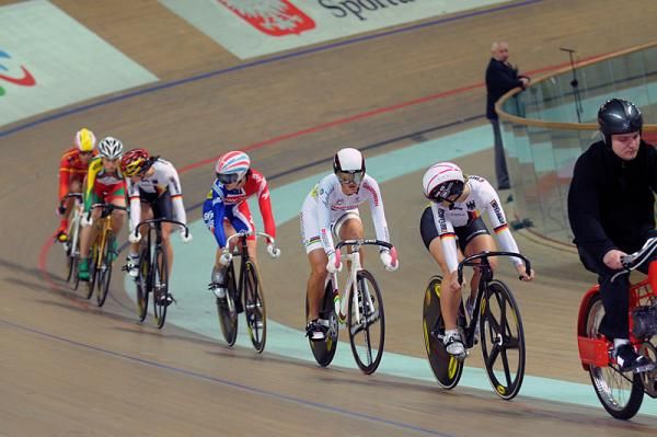 Riders keep an eye on each other in a second round heat of the women's keirin.