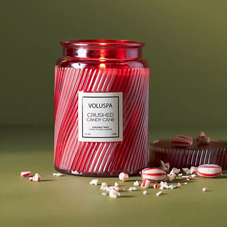 18oz candle in a red and white striped jar