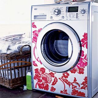 laundry room with washing machine and basket