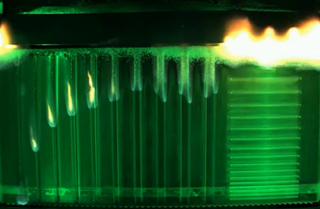 A screenshot shows the Saffire-V experiment mid-flame.