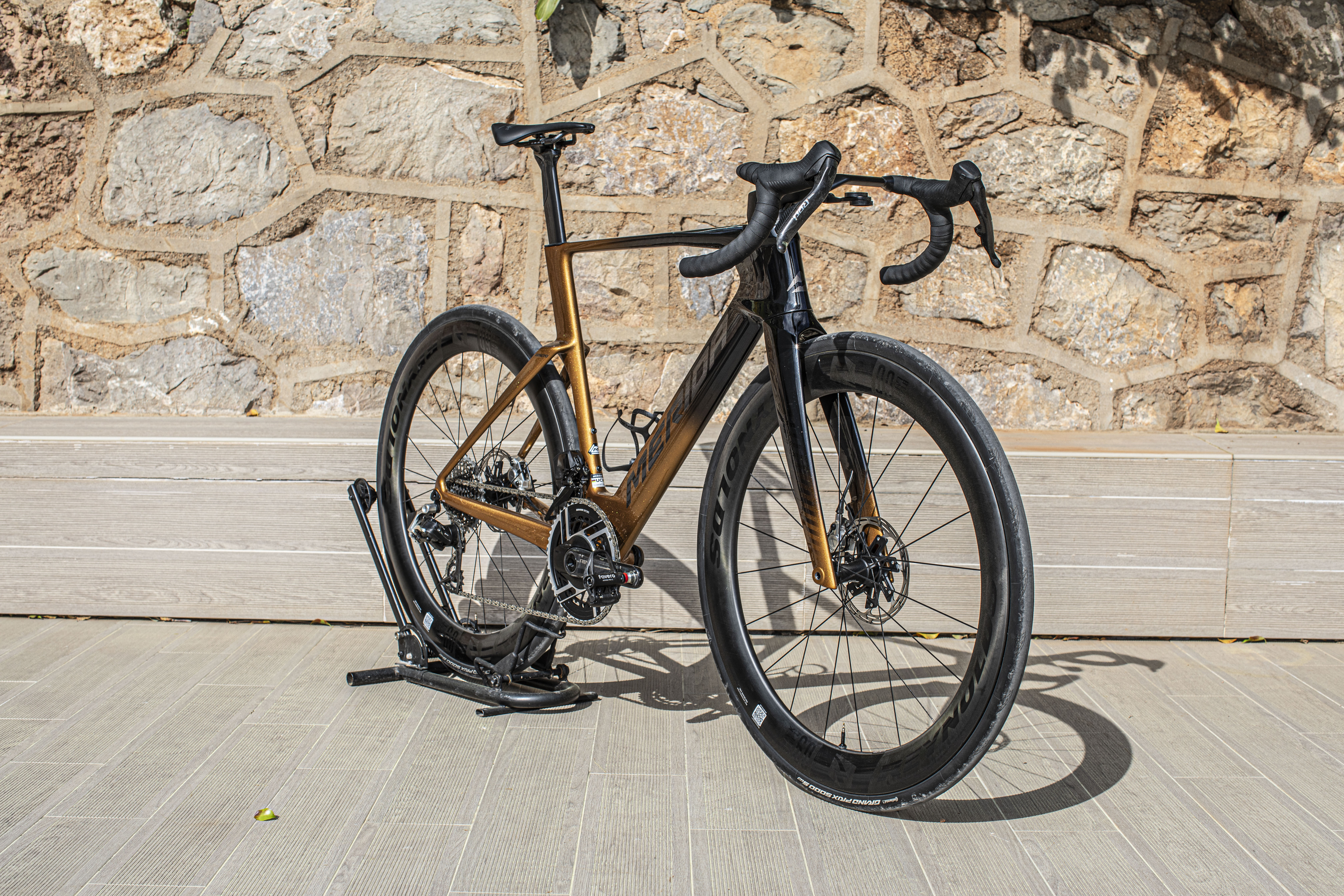 Fifth-generation Merida Reacto pictured outside with stone wall background