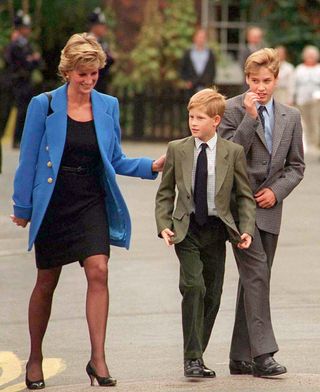 Prince William with Diana, Princess of Wales and Prince Harry on the day he joined Eton in September 1995. (Photo by Anwar Hussein/WireImage)