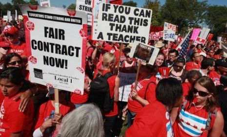 Striking Chicago teachers and their supporters attend a rally at Union Park on Sept. 15 in Chicago. An estimated 25,000 people gathered in the park in a show of solidarity.