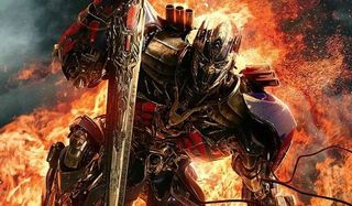 transformer with sword in front of fire