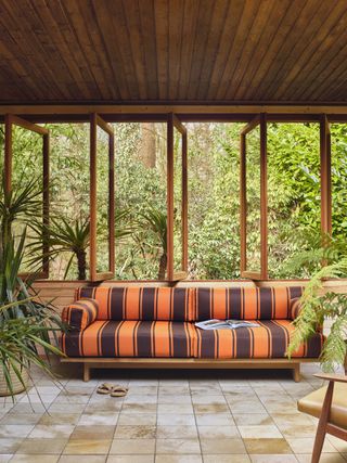A striped orange and brown sofa