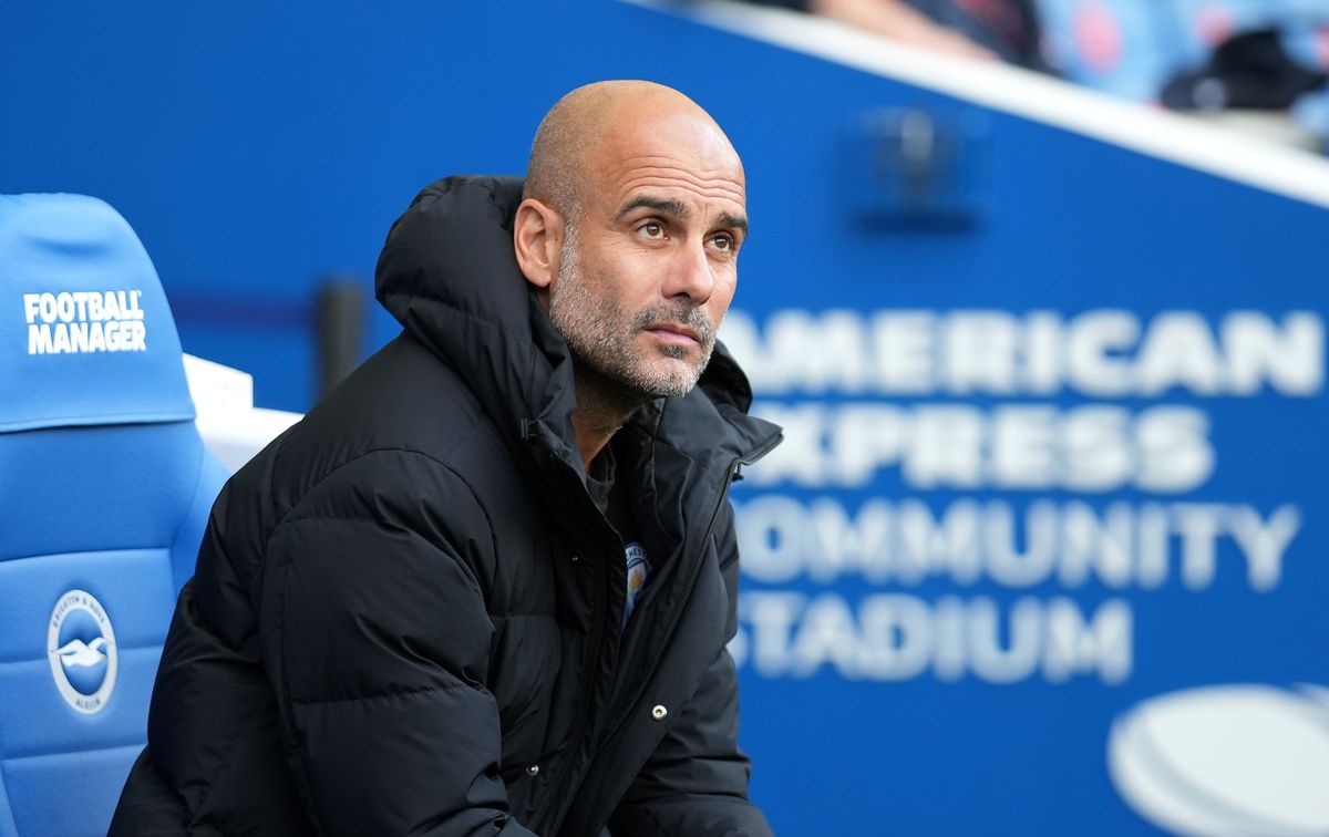 Manchester City manager Pep Guardiola sitting | West Ham v Manchester City live stream