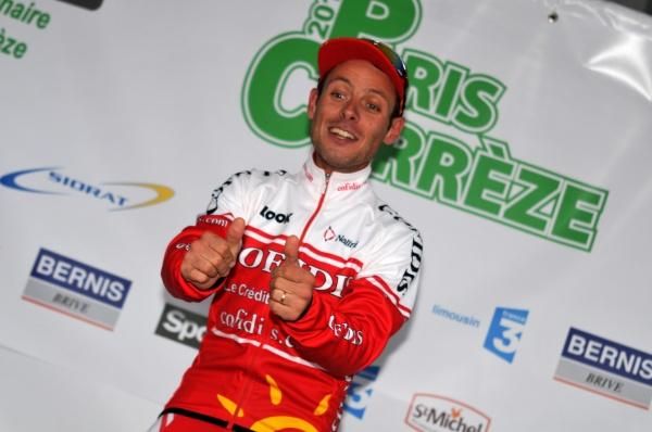 Stage winner Mickael Buffaz celebrates on the podium.