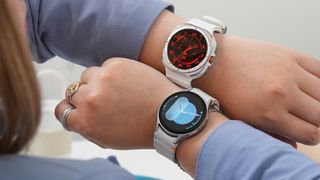 Person wearing the Samsung Galaxy Watch 7 and Galaxy Watch Ultra on opposing wrists