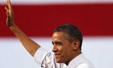 President Barack Obama waves to supporters in Las Vegas on Sept. 12: According to a new poll, Obama holds substantial leads in Florida, Ohio, and Virginia.