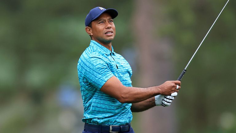 Tiger Woods plays a shot