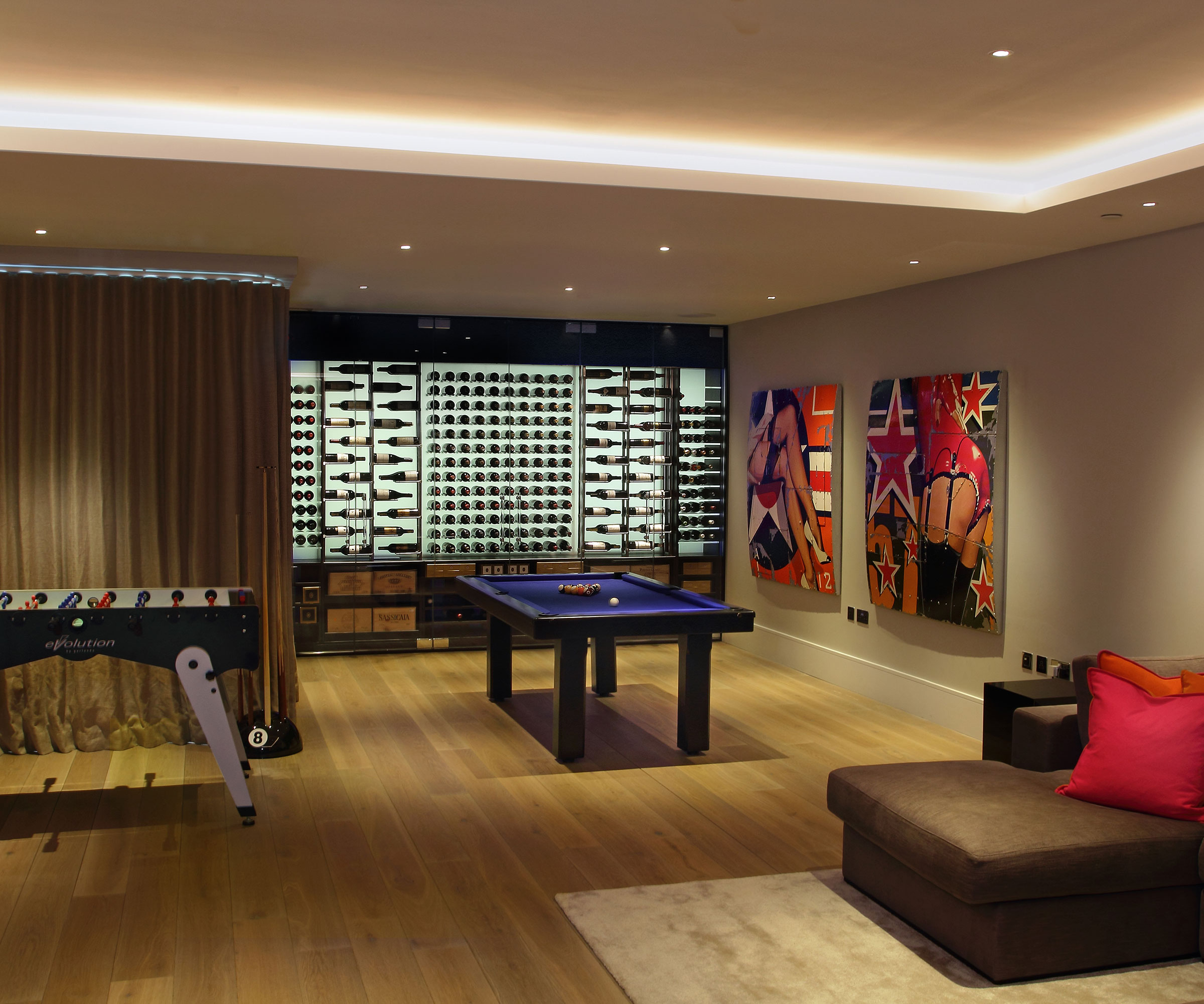 cellar conversion games room with wine wall