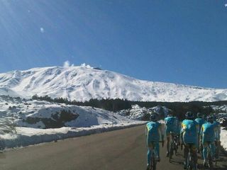 Astana riders on their way to the snow-covered Etna
