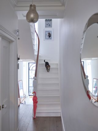 All white hallway and stairs