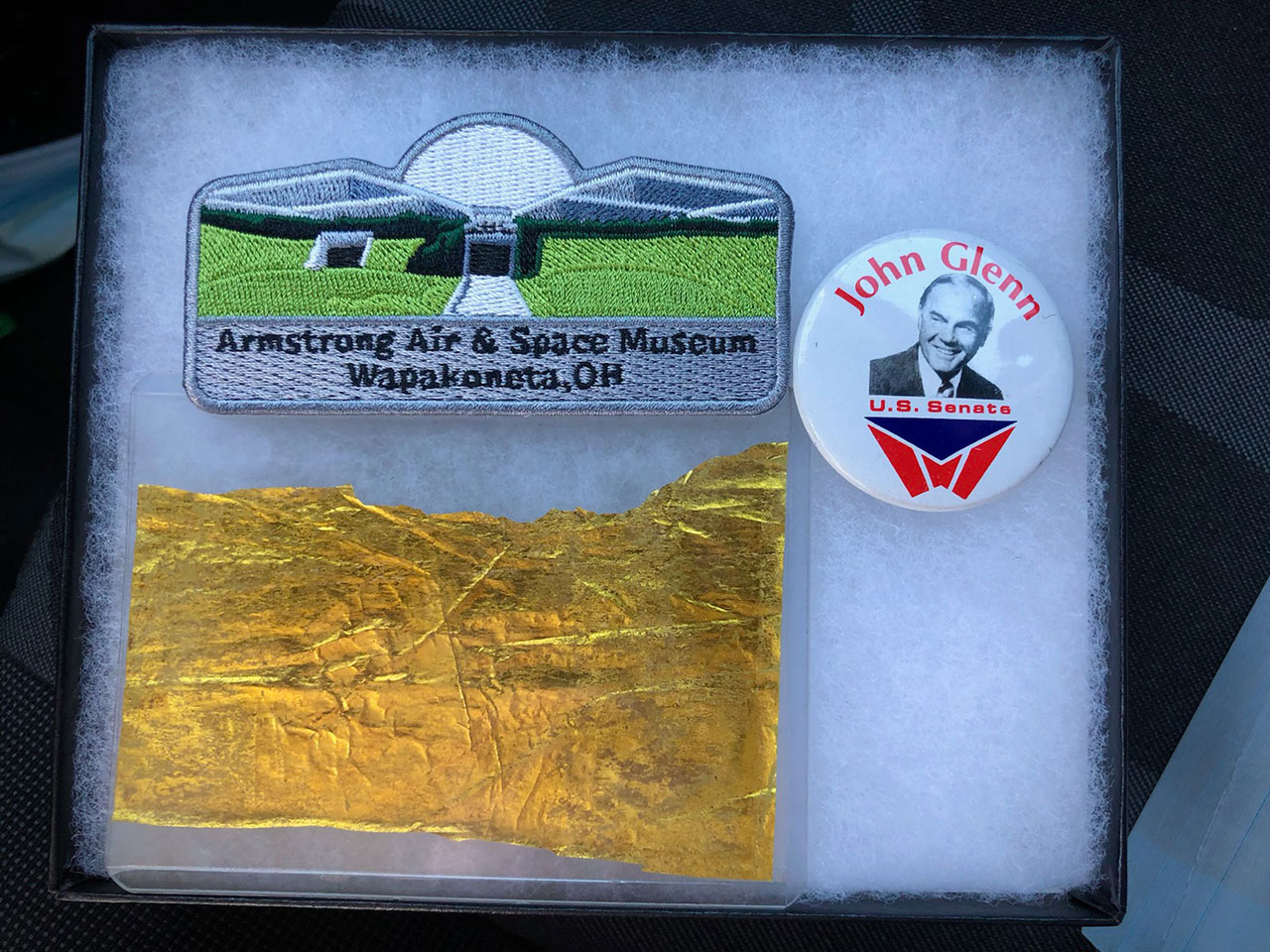 Ax-1 pilot Larry Connor is flying three items for the Armstrong Air & Space Museum, including a patch, a John Glenn campaign button and a segment of Kapton foil removed from the Apollo 11 command module that flew to the moon.